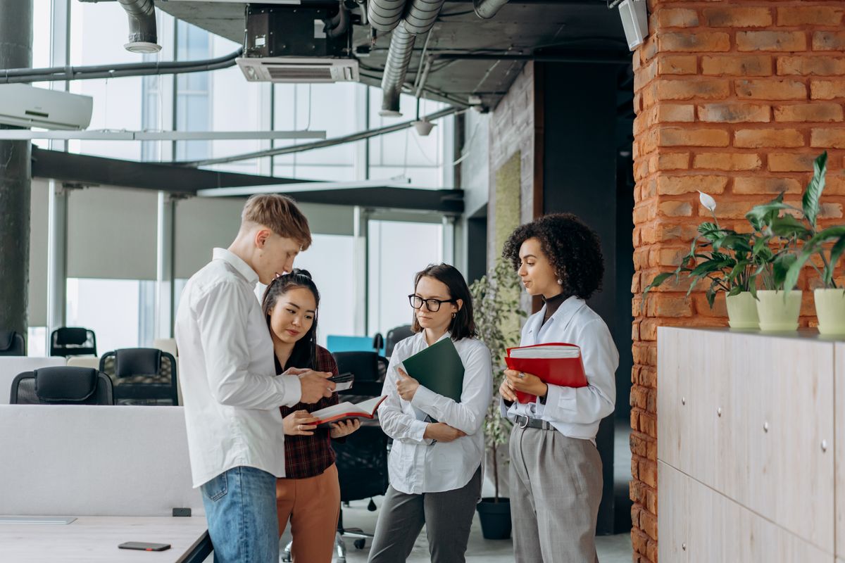 A diverse team of employees collaborating in a modern corporate office